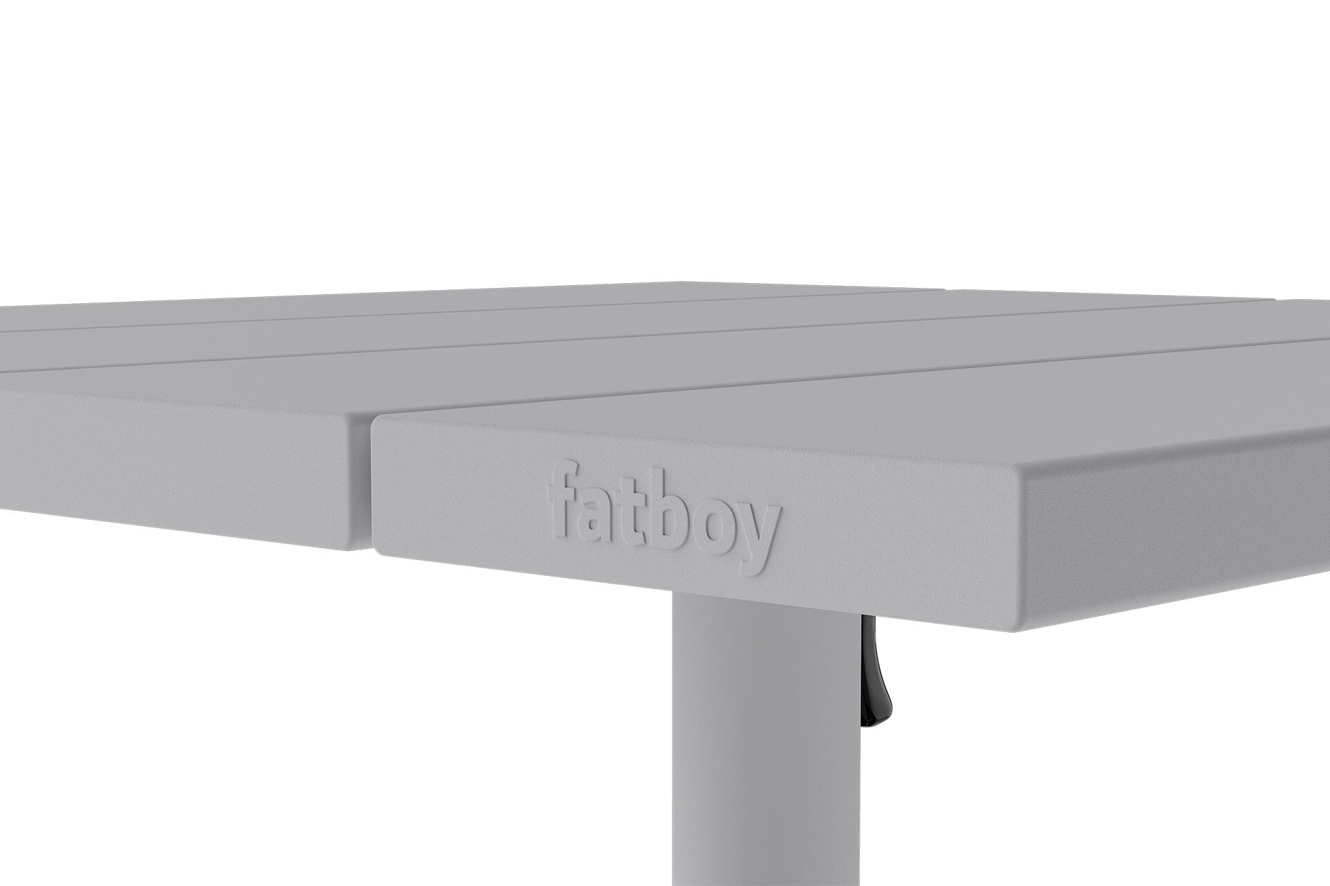 Close-up of table edge with embossed 'fatboy' logo